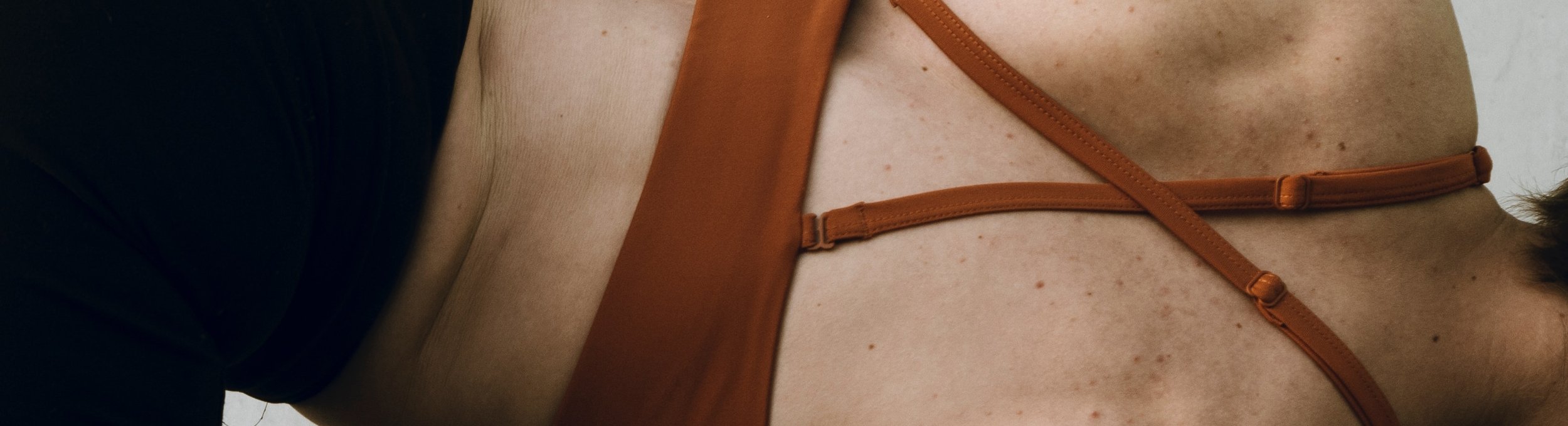 Close up of woman's back while doing yoga pose